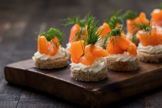 Smoked salmon canapés by Mateusz Gzik at shutterstock.com